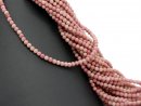 Pierced, pink rhodonite beads