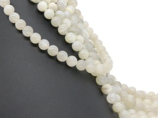 Perles blanches percées en pierre de lune