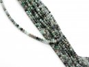 Small, pierced emerald beads