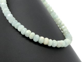 Large, faceted aquamarine gemstones in light blue and light green