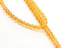 Pierced, small rock crystal beads in orange