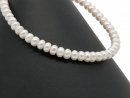 Pierced, loose cultured pearls in button shape
