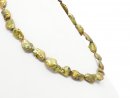 Pierced, baroque biwa pearls in green gold