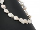 Pierced, baroque biwa pearl discs in white