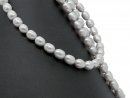 Pierced, oval cultured pearls in light grey