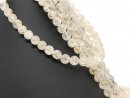 Pierced, glittering gemstone beads made of rock crystal