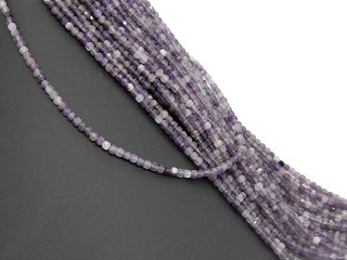 Pierced, purple-coloured fluorite cubes