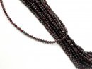 Faceted, pierced, dark red garnet beads