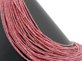 Pink-coloured, faceted, pierced tourmaline cubes
