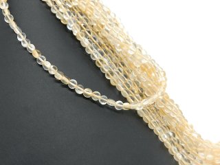 Faceted, pierced citrine discs in yellow