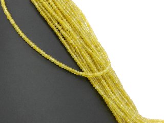 Gelbe, durchbohrte, facettierte Achatrondelle