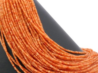 Orange-coloured, pierced, faceted agate rondelle