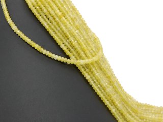 Gelbe, durchbohrte, facettierte Achatrondelle