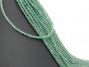 green-coloured, pierced, faceted agate rondelle