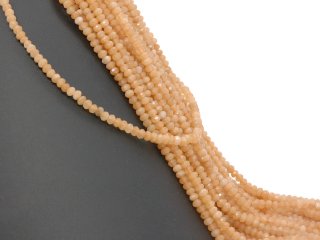 Orangefarbene, durchbohrte, facettierte Achatrondelle