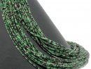 Faceted ruby-zoisite cubes in black, magenta and green