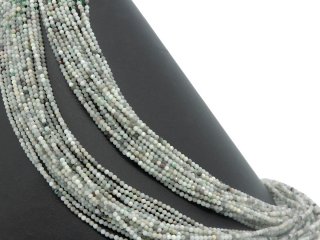 Small, faceted, pierced emerald beads