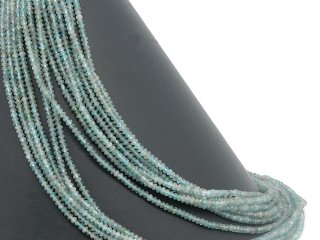 Faceted, pierced apatite rondelles in green-blue