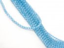 Faceted, blue, pierced topaz spheres