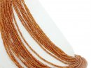 Orangefarbene, durchbohrte Granatkugeln