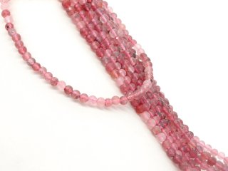 Pierced, faceted quartz beads in pink