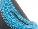 Faceted, blue, pierced topaz spheres