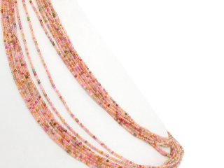 Petites boules de tourmaline colorées percées