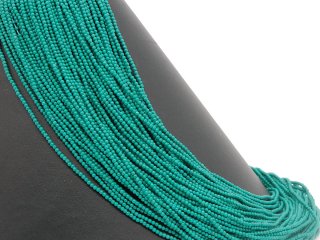 Pierced, small, turquoise-coloured howlite beads