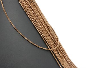 Petites boules dhématite percées et facettées de couleur brune