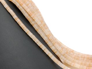 Peach-coloured, pierced agate discs