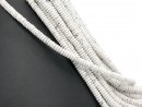 Pierced, white howlite discs with grey marbling