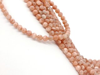 Faceted, pierced, pink-coloured moonstones