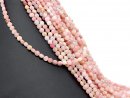 Pierced, faceted pink opal discs