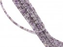 Pierced, purple-coloured fluorite discs