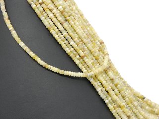 Pierced heishe of green-yellow opals