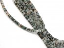 Green-brown, narrow, pierced aventurine discs