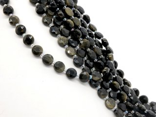 Pierced, faceted obsidian discs in black