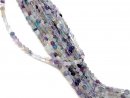 Pierced, colourful fluorite discs with facets