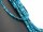Pierced, blue spheres made of apatite