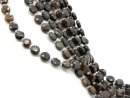 Pierced, faceted bronzite discs in brown