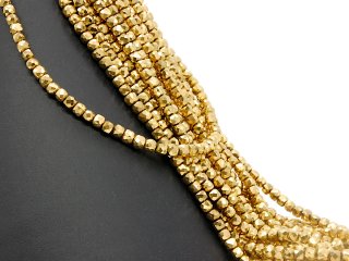 Pierced, sparkling, golden haematite cubes