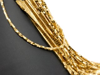 Pierced, sparkling, golden haematite cubes