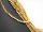 Pierced, sparkling, golden haematite leaves