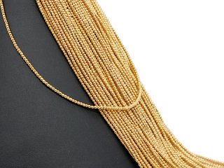 Durchbohrte, funkelnde, goldene Hämatit-Kugeln