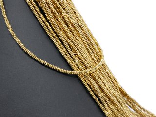Pierced, faceted, golden haematite lenses