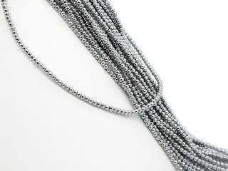 Shiny spheres of hematite in grey