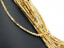 Pierced, sparkling, golden haematite cubes