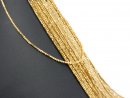 Pierced, sparkling, golden haematite prisms