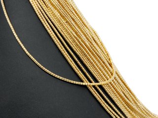 Durchbohrte, funkelnde, goldene Hämatit-Zylinder