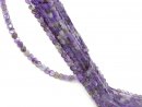 Pierced, purple-coloured fluorite hearts